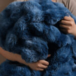 Snuggle hug of tie-dye blue bubble bunny faux fur blanket, ultra soft fuzzy throw