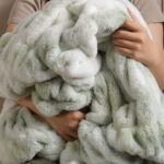 Soft hug of tie-dye sage green dual-sided elastic bunny faux fur blanket