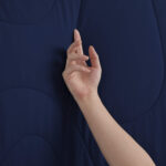 Dark Blue Cooling Blanket Touch Shot, Soft Cooling Fabric Texture Close Up