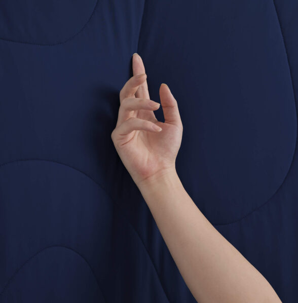 Dark Blue Cooling Blanket Touch Shot, Soft Cooling Fabric Texture Close Up