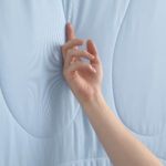 Light Blue Cooling Blanket Touch Shot, Smooth Cooling Fabric Close Up